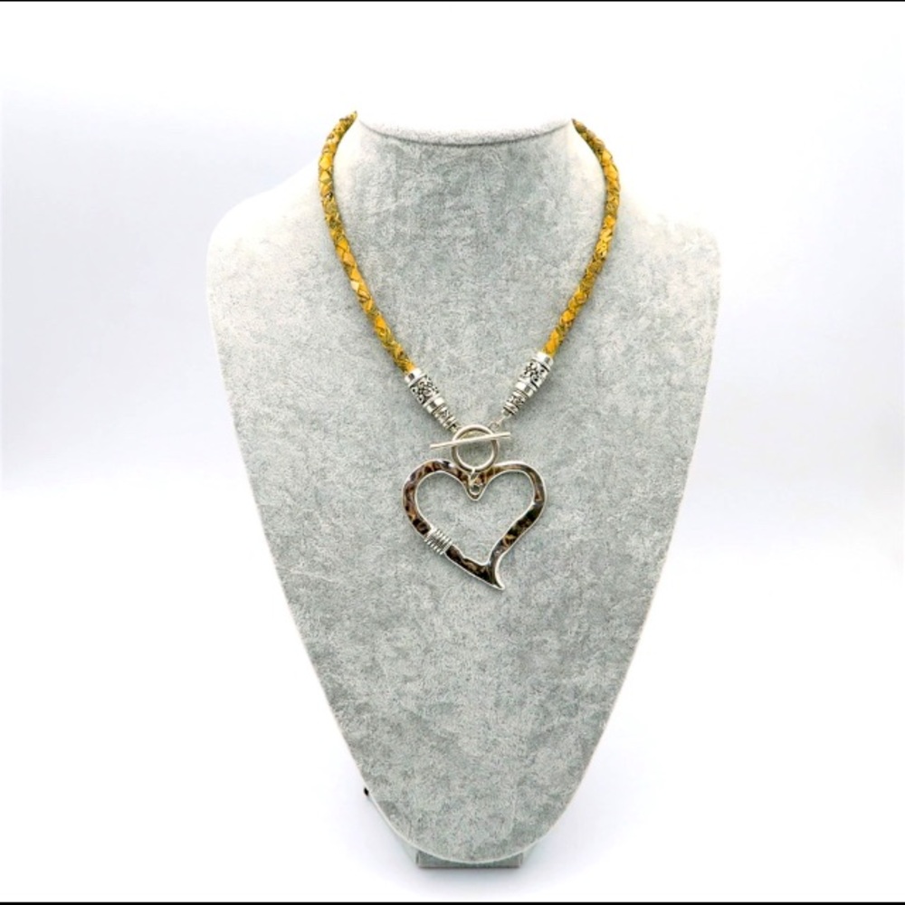 Large silver tone heart on a cork leather necklace!